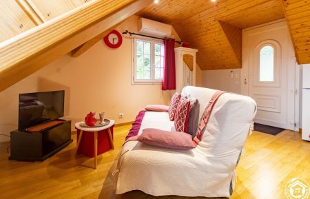 Coin salon cocooning avec téléviseur et wifi Gîte n°65G172911 Arcizans-Avant - Hautes-Pyrénées - Coin salon cocooning avec téléviseur et wifi